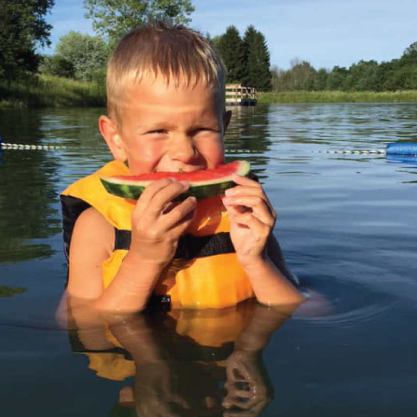 Photo of boy eating watermelon